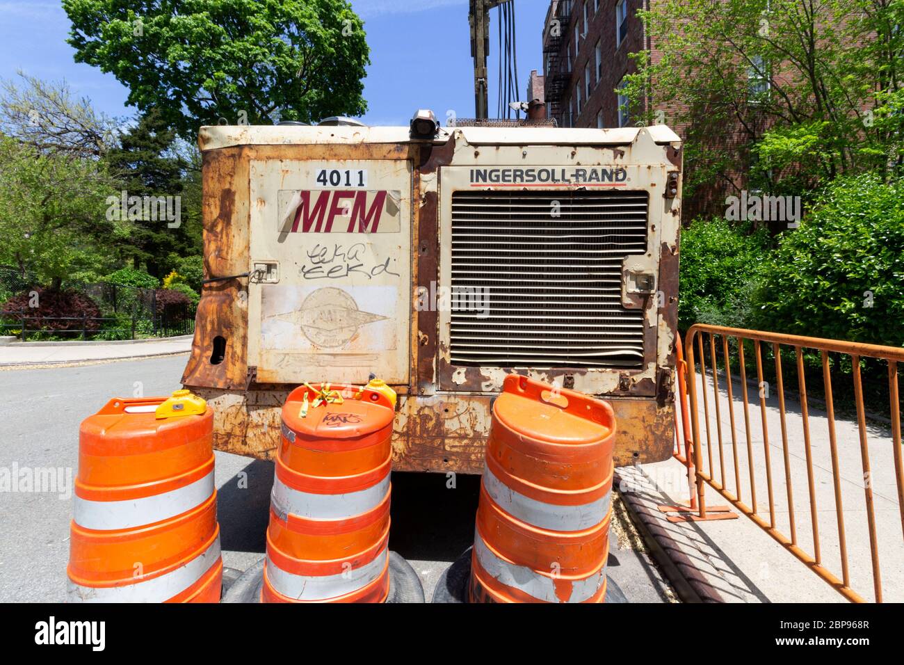 the back of a industrial bulldozer by Ingersoll Rand or Trane Technologies, with the brand name showing, parked on a new york city street Stock Photo
