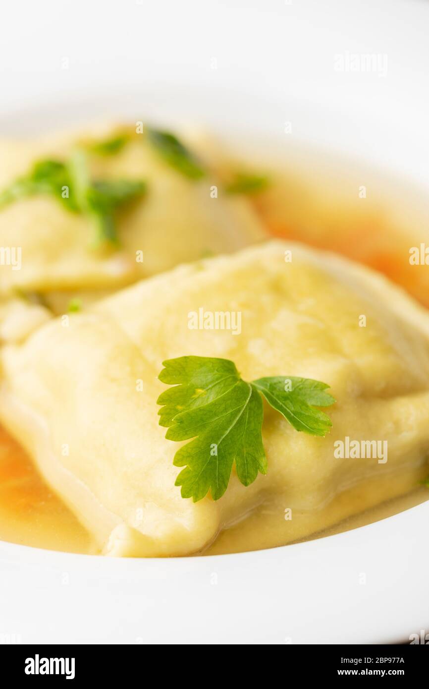 swabian maultasche in broth Stock Photo