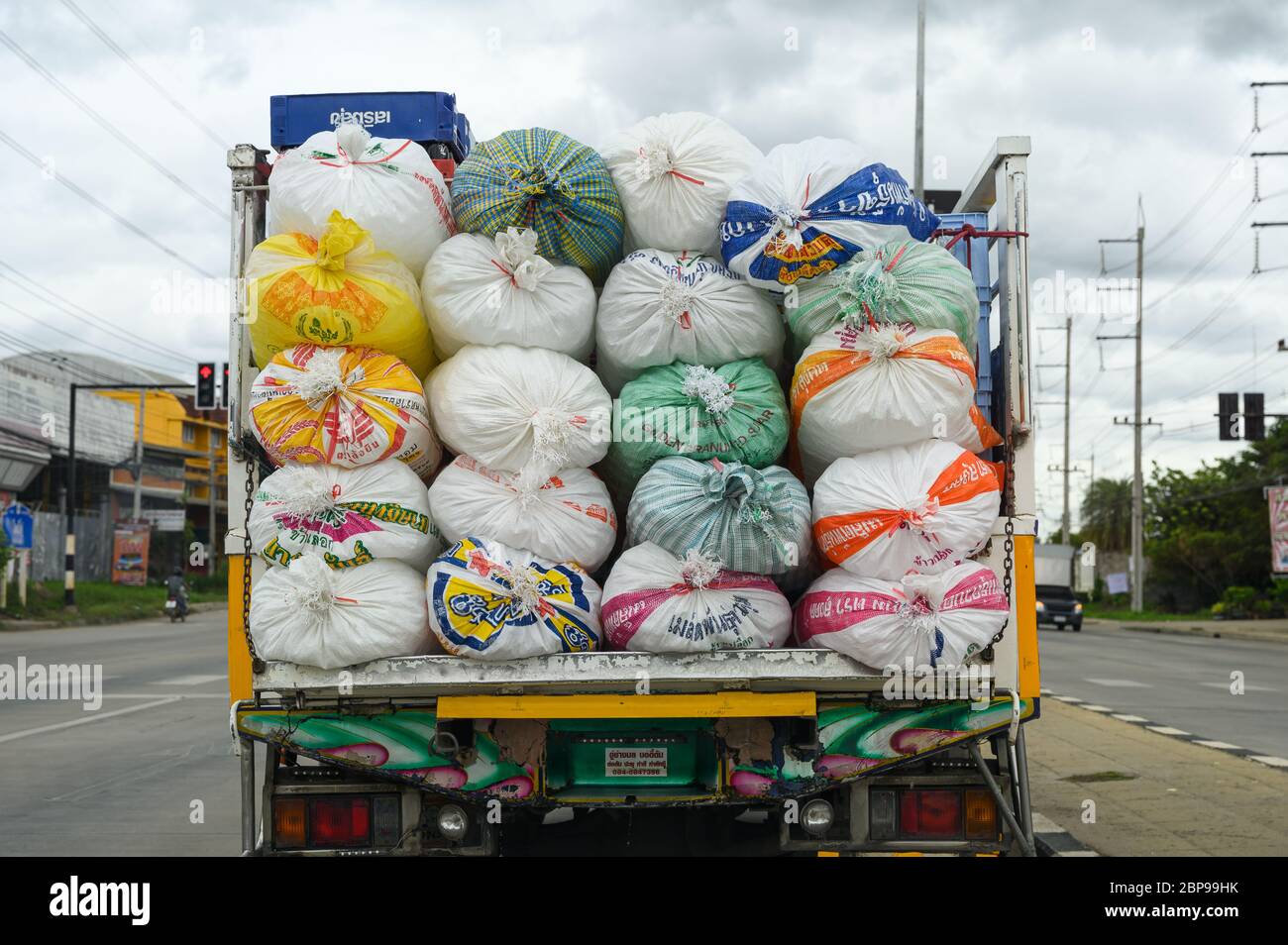 Ratchaburi, Thailand - Aug 27 2019 : Truck carries and transport of beverage and ice sacks stacked on rear Stock Photo