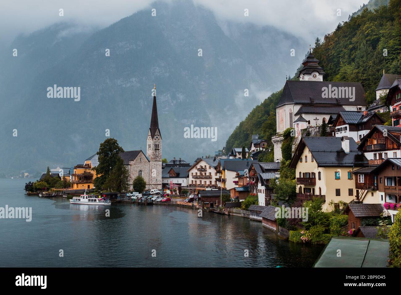 Hallstatt view in a foggy day and clouds between the mountains Stock Photo