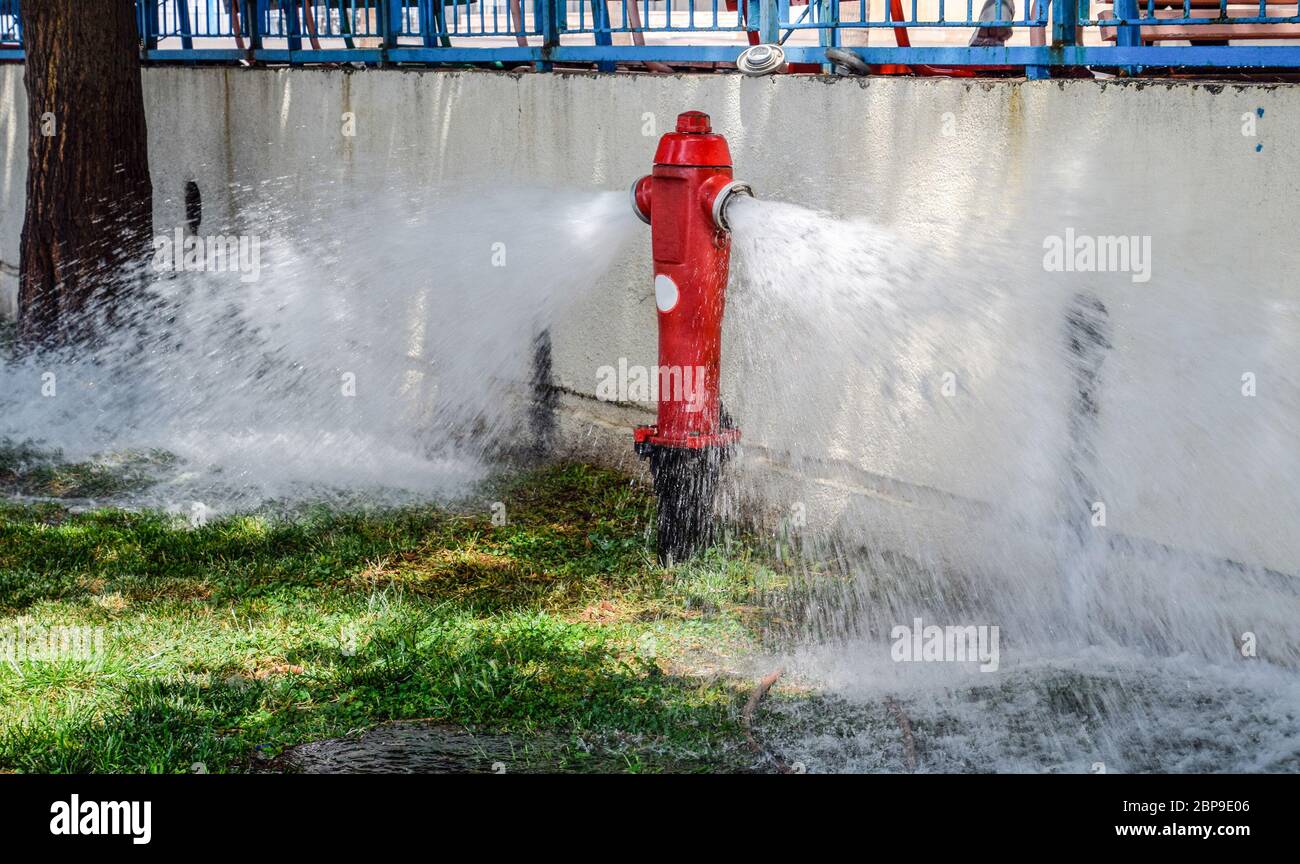Open fire hydrant, water flows from a fire hydrant Stock Photo Alamy