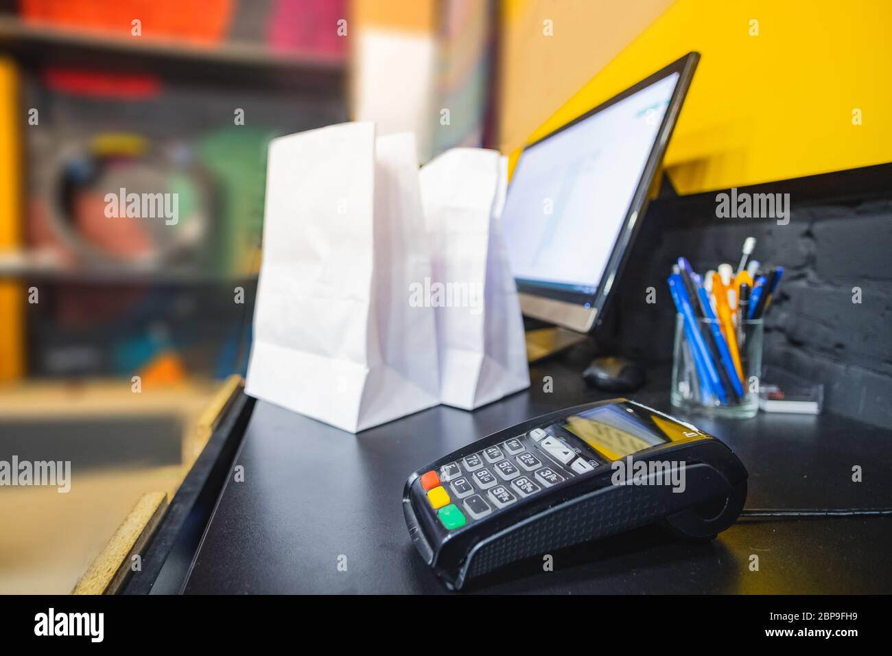 Payment terminal on a table, closeup view. POS terminal at cashier