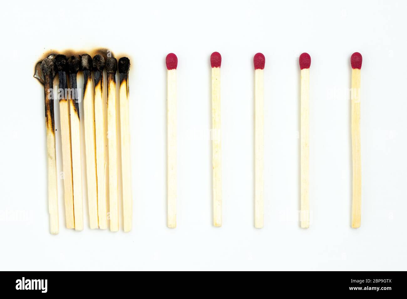 Social distancing concept using burnt out match sticks Stock Photo