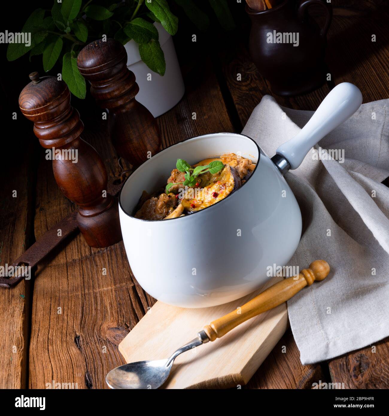 Veal goulash with baked aubergine and herbs Stock Photo - Alamy