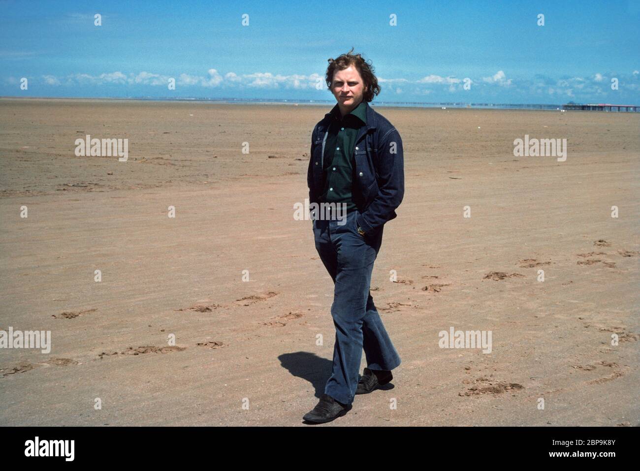 Anthony Holdon writer broacaster and critic at Southport beach 1976 Stock Photo