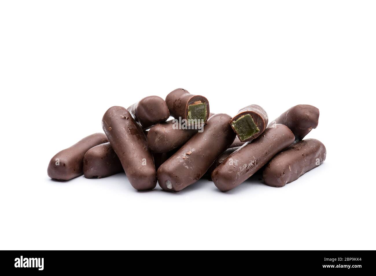 candied ginger covered with dark chocolate, on white background Stock Photo Alamy