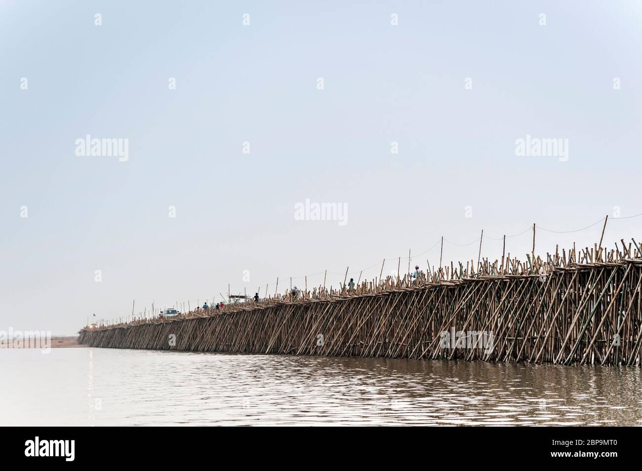 Bamboo bridge over the Mekong River at twilight. Kampong Cham, Cambodia, Southeast Asia Stock Photo
