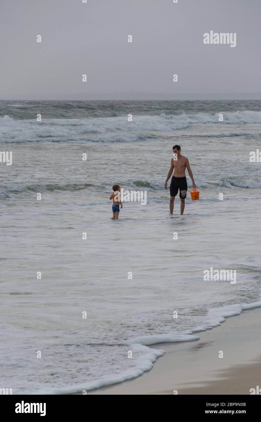 18th May, 2020. Father and son enjoying on Sernabatim Beach. Fresh COVID-19 cases were reported in Goa after it was declared Green Zone. Stock Photo