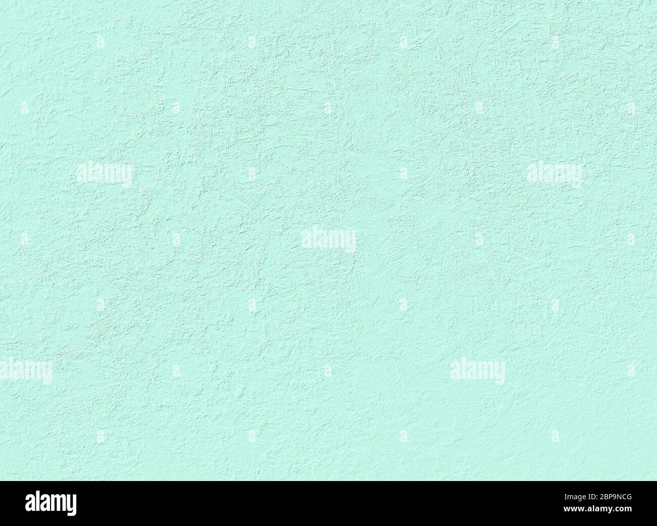 delicate light green stucco wall useful as a background Stock Photo