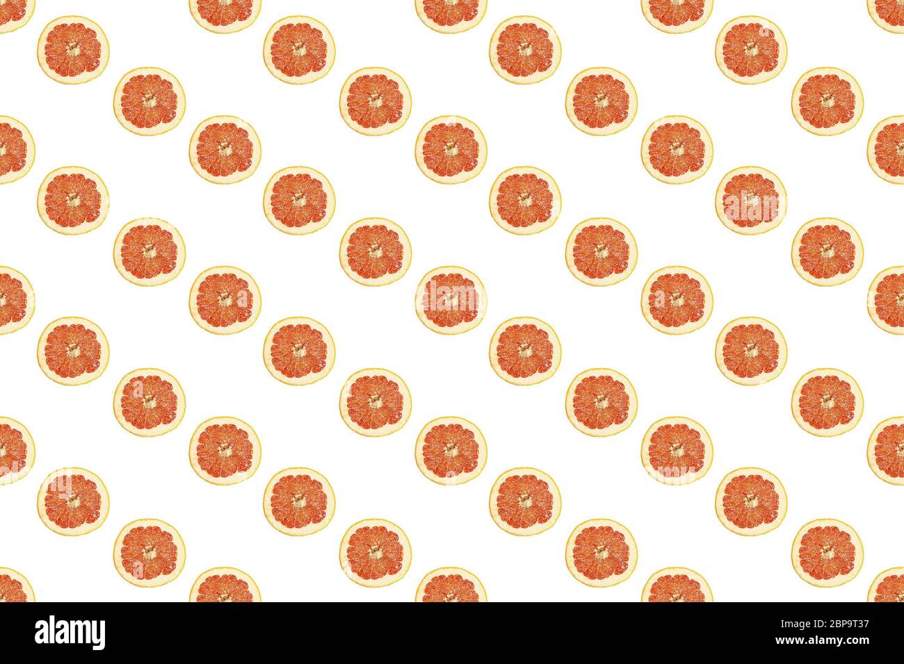 Seamless pattern of isolated slices of grapefruit. Wallpaper for