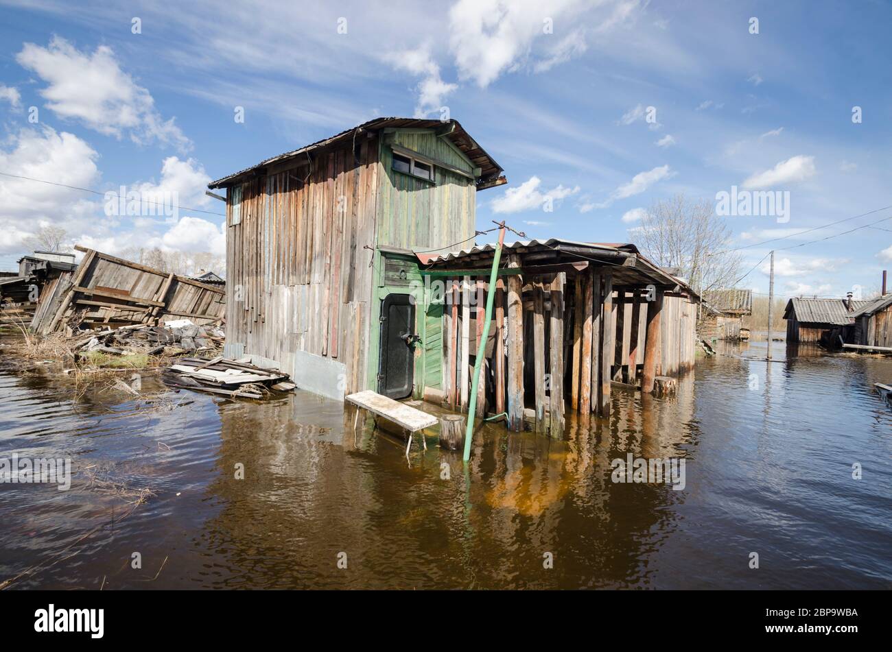 High water in Russia. Flooded residential buildings and farm buildings. Russia, Arkhangelsk region Stock Photo