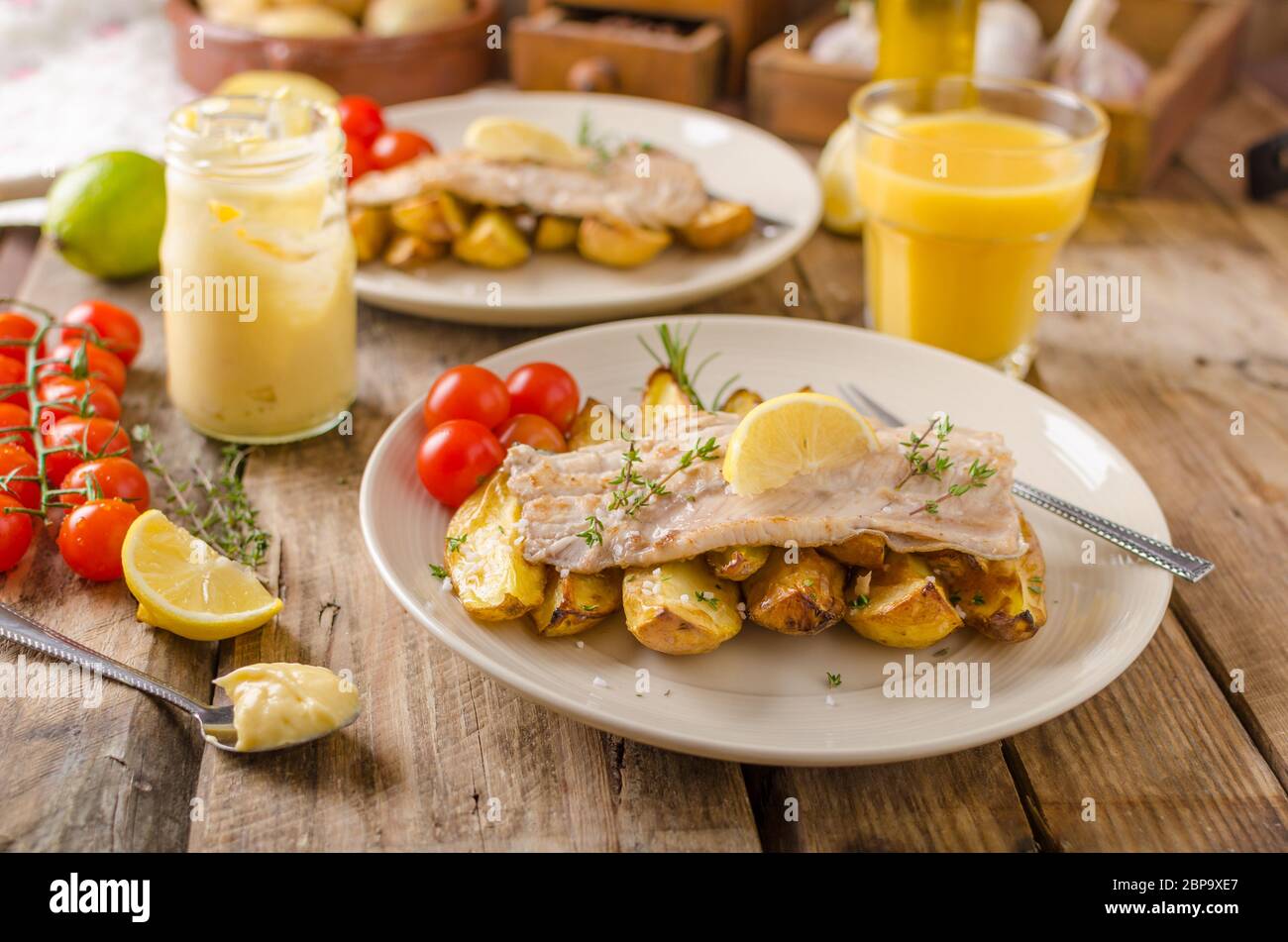 Baked rainbow trout with roasted potatoes and homemade mayonnaise Stock