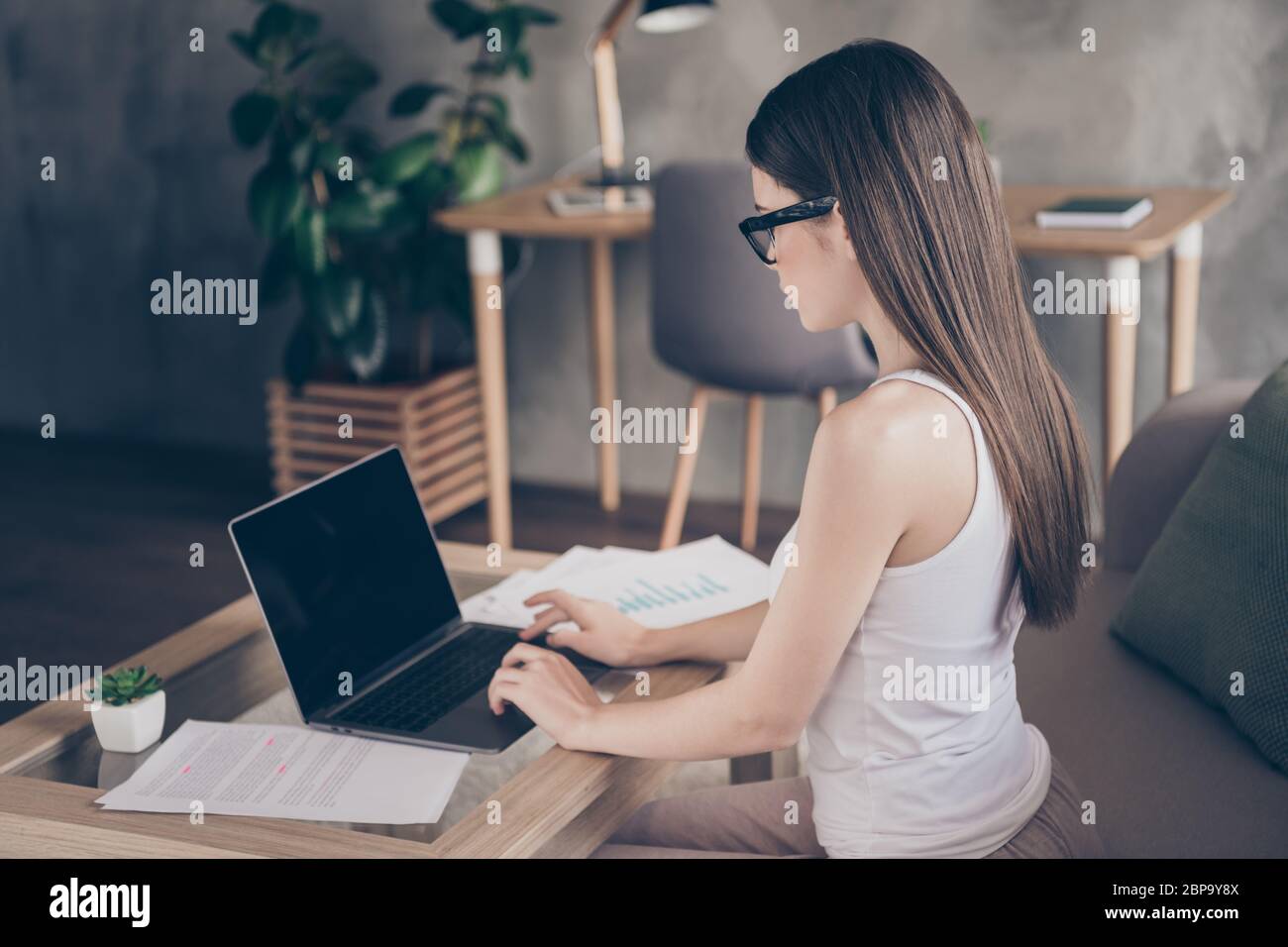 Profile side photo of focused girl economist work remote laptop have online communication colleagues partners search start-up progress project Stock Photo