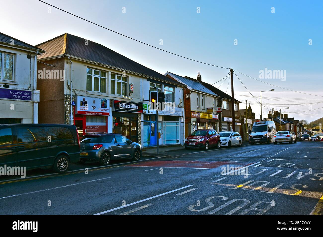 A row of small shops with flats over, in the centre of the small rural