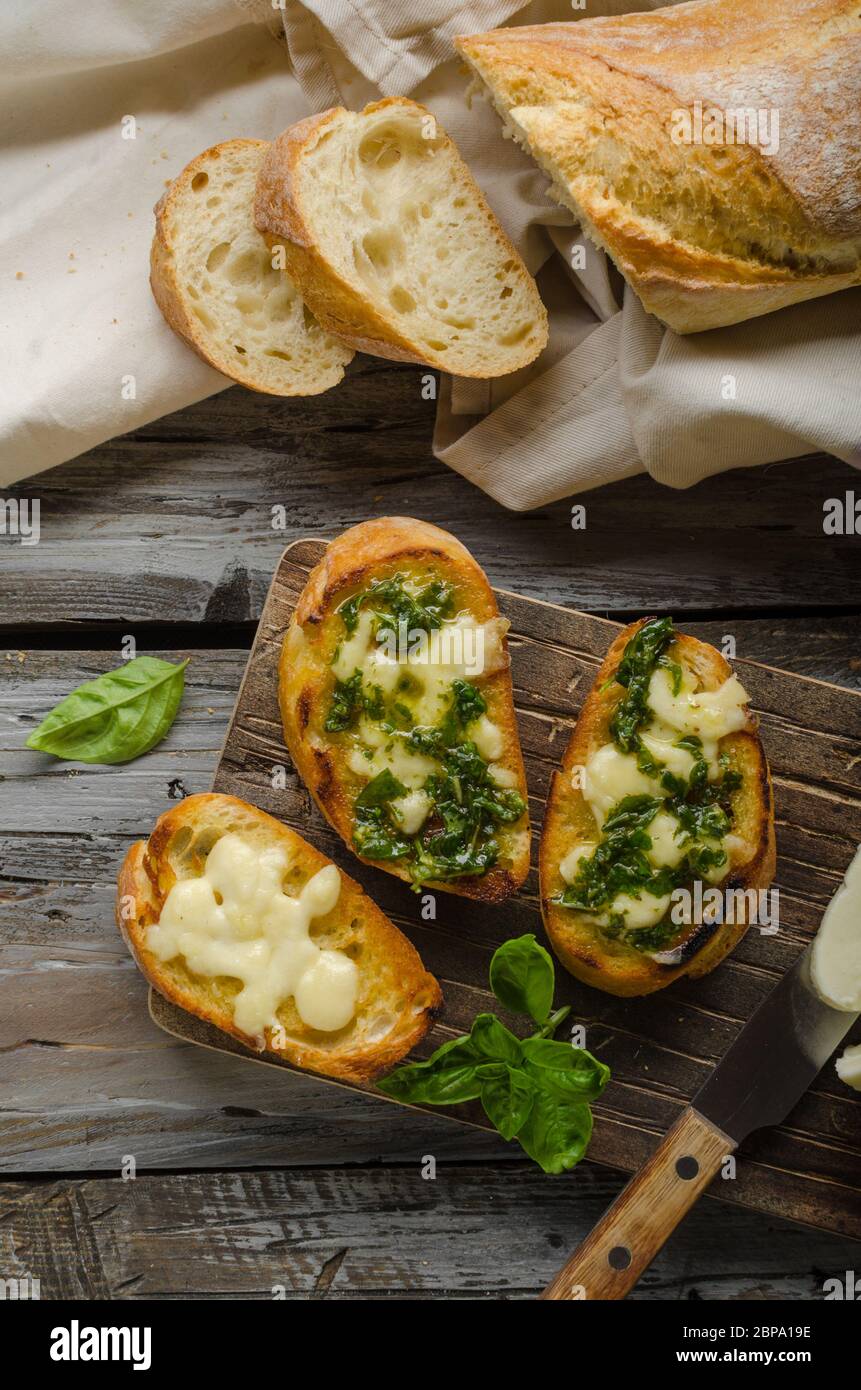 Garlic herbs toast with fresh mozzarella, food photography, vintage photography Stock Photo