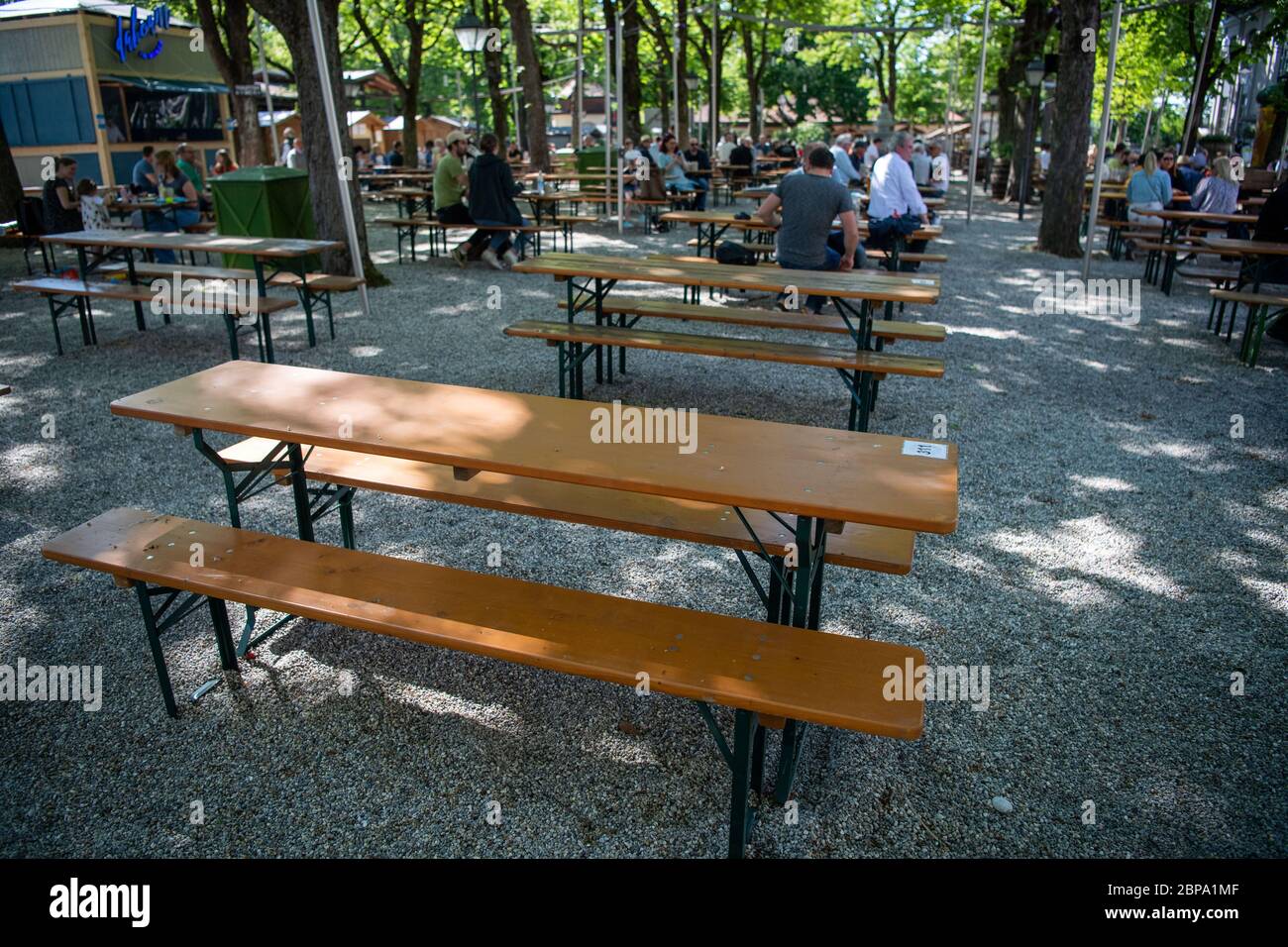 Munich, Germany. 18th May, 2020. Empty beer tent sets can be seen in a beer garden. In compliance with strict hygiene and distance rules, outdoor restaurants in Bavaria are allowed to be open again until 8 p.m. after a corona break. Credit: Lino Mirgeler/dpa/Alamy Live News Stock Photo