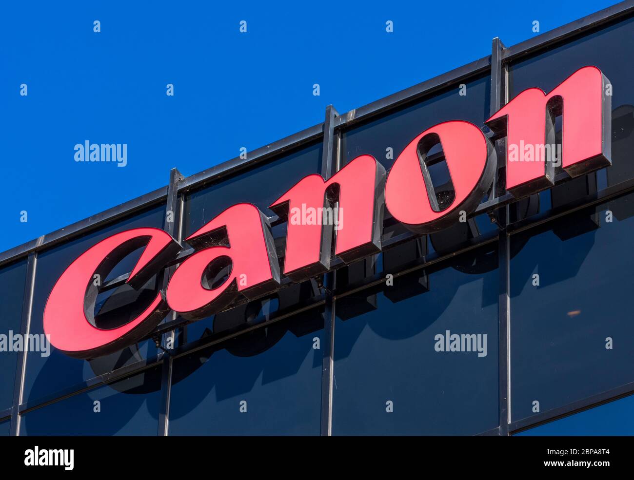 Canon sign atop Canon Solutions America headquarters campus in