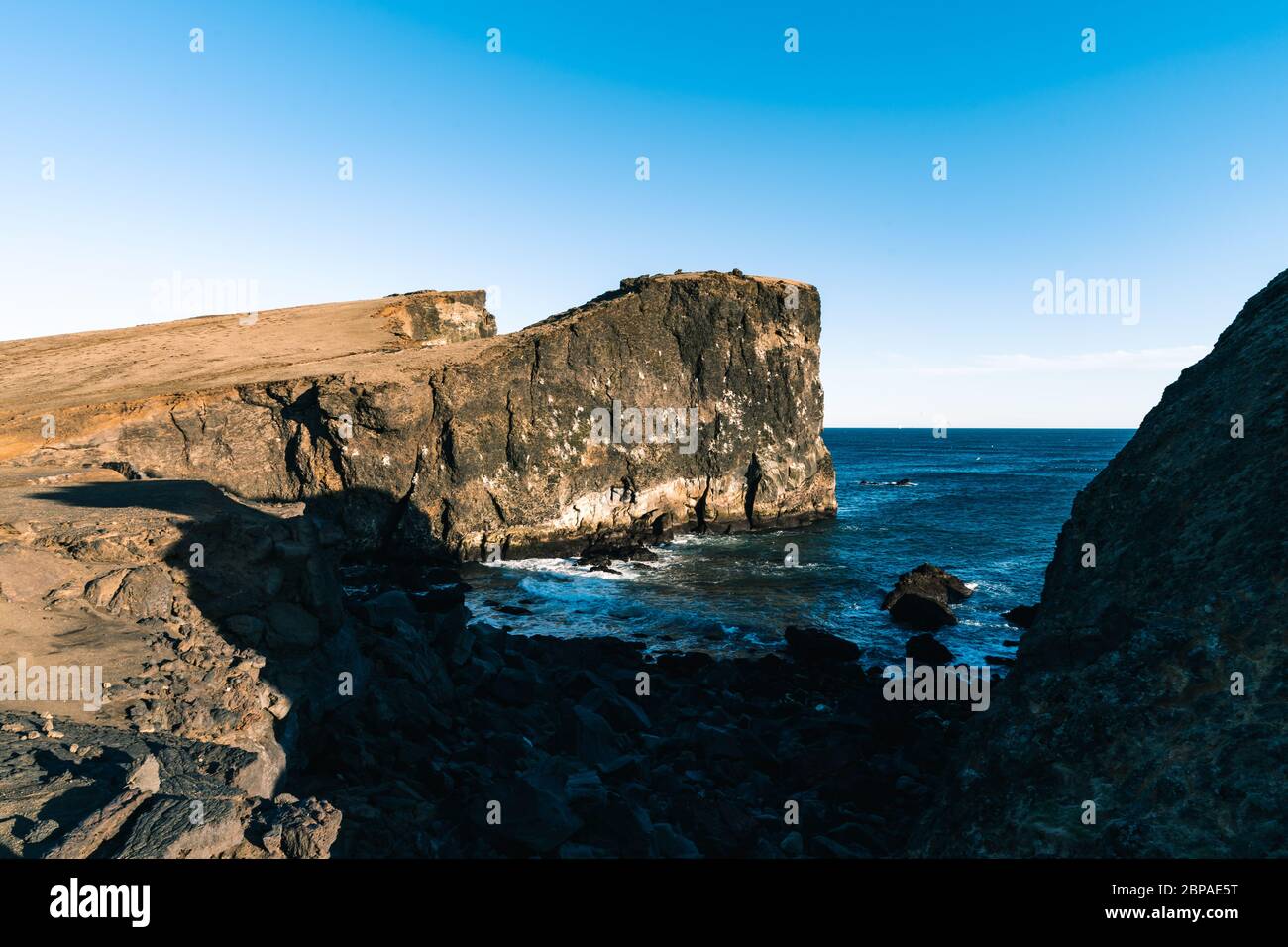 Marvelous sunset on popular tourist attraction Valahnukamol bay in southern Iceland. Cliffs are located in Reykjanes peninsula and are easily Stock Photo