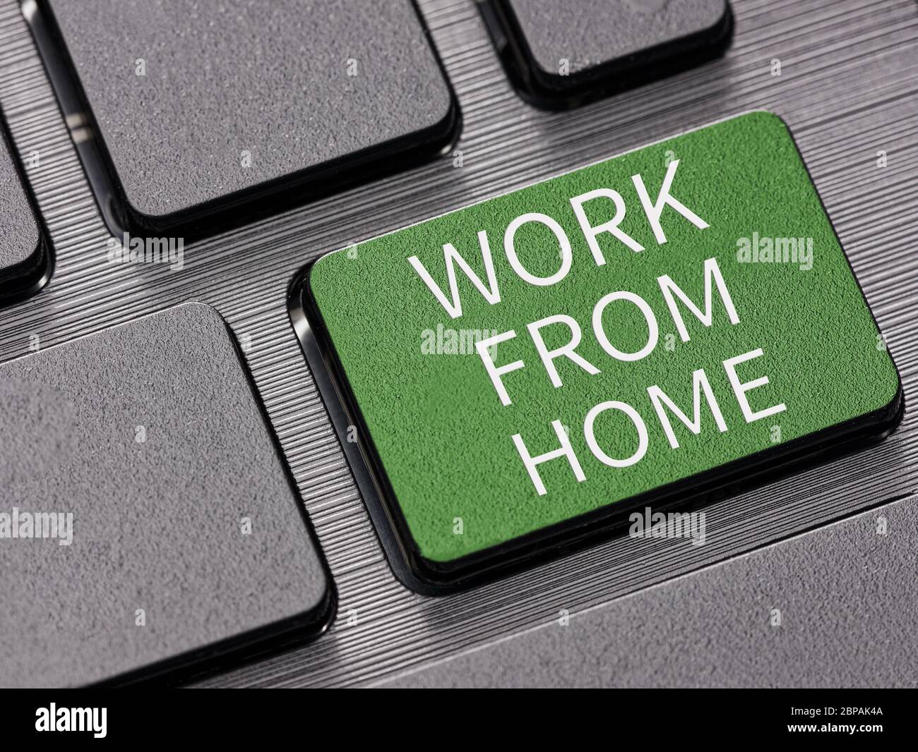 Work from home key on computer keyboard warning message concept Stock Photo