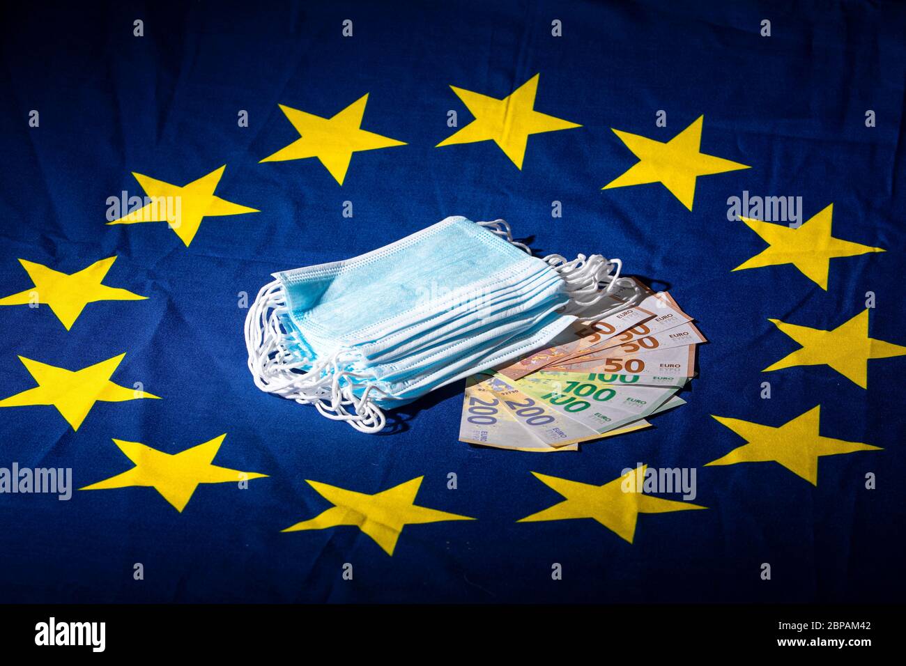 Illustration of anti pandemic material on a european flag, illustrating the business made with some panic buying Stock Photo