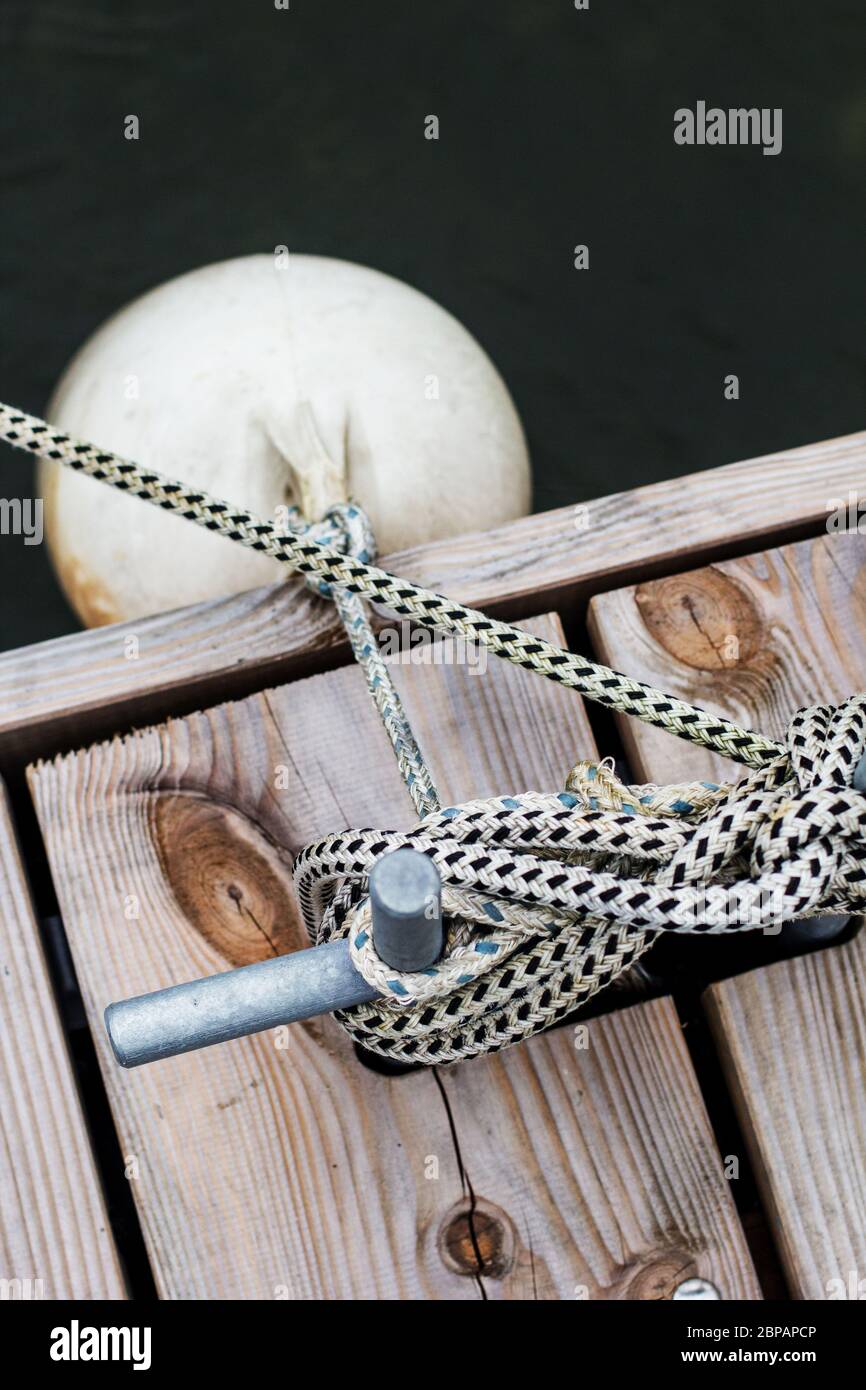 Mooring bollard with mooring rope and fender buoy Damage safety