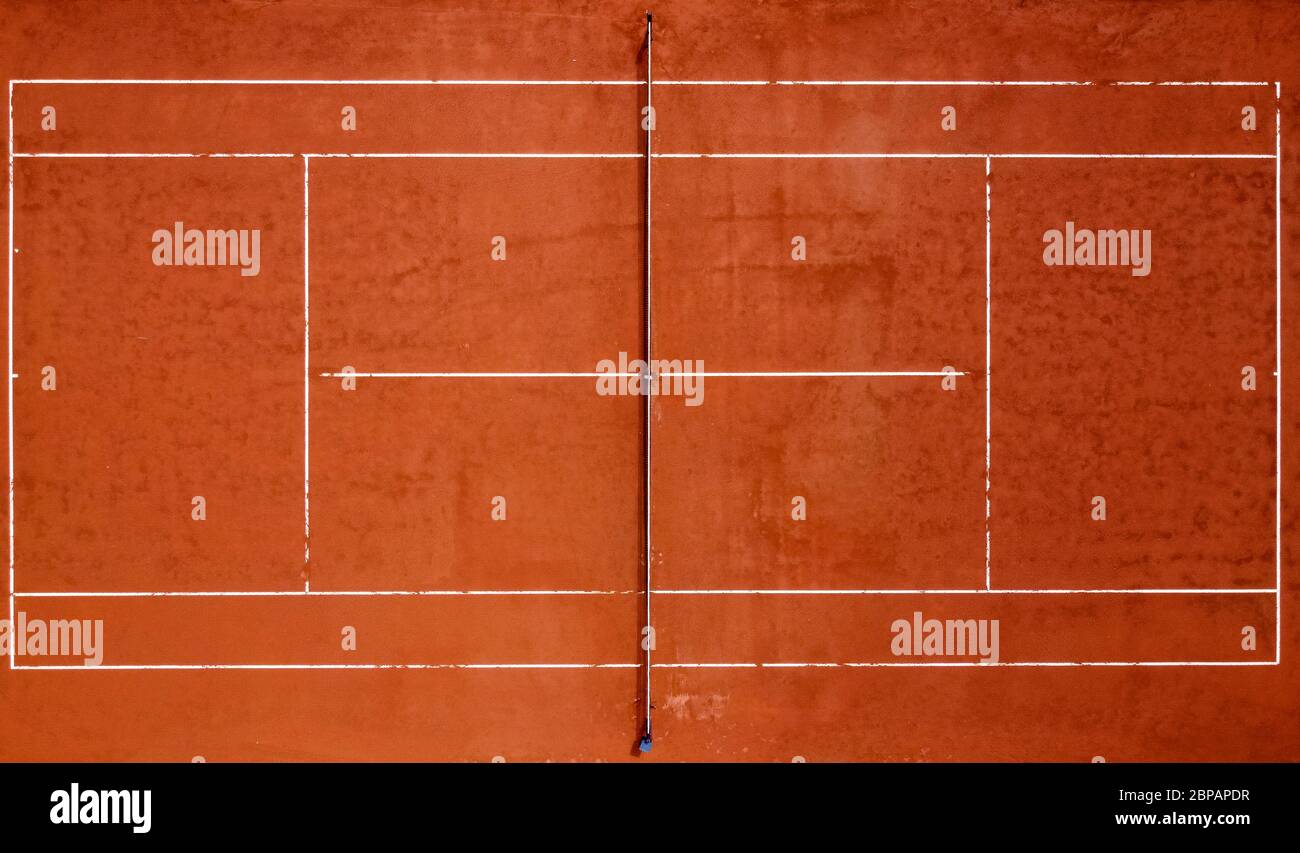 Grugliasco, Italy - 18 May, 2020: (EDITORS NOTE: Image was created with a drone.) Aerial view shows an empty clay tennis court. The lockdown due to the COVID-19 coronavirus emergency banned all sports activities. Credit: Nicolò Campo/Alamy Live News Stock Photo