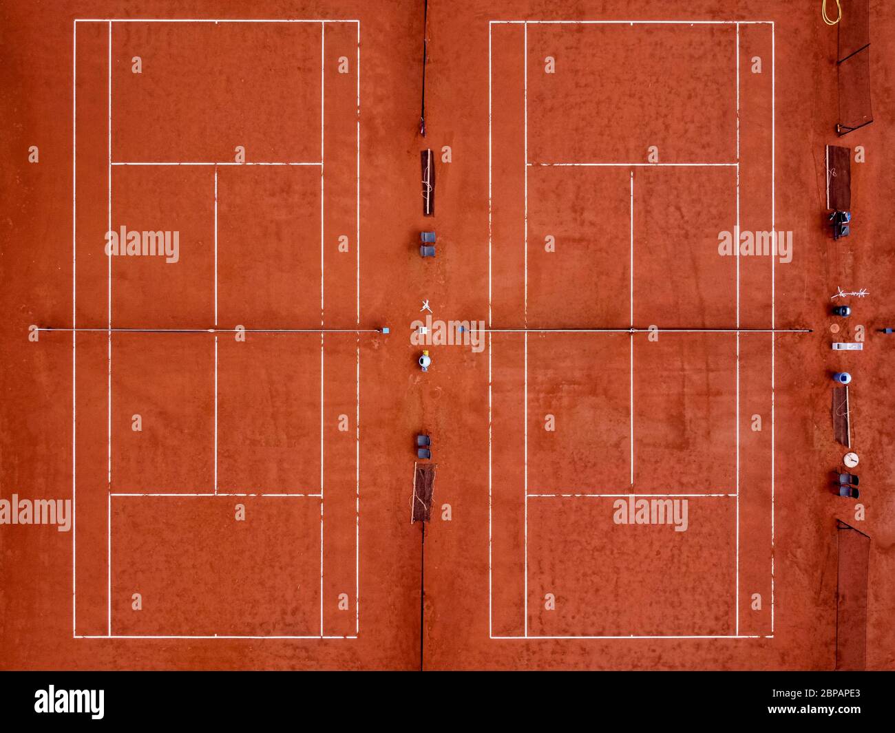 Grugliasco, Italy - 18 May, 2020: (EDITORS NOTE: Image was created with a drone.) Aerial view shows two empty clay tennis courts. The lockdown due to the COVID-19 coronavirus emergency banned all sports activities. Credit: Nicolò Campo/Alamy Live News Stock Photo