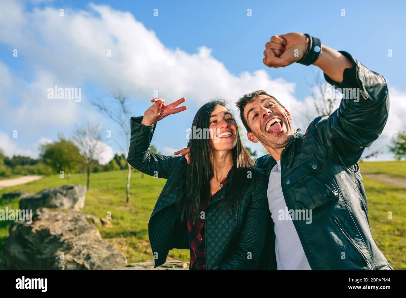 Couple taking a selfie with a smartwatch Stock Photo