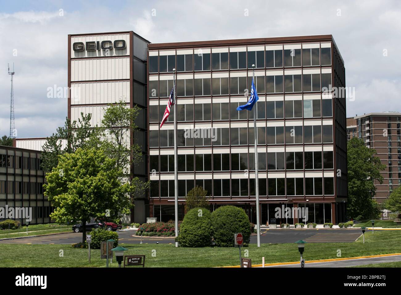 A logo sign outside of the headquarters of The Government Employees Insurance Company (GEICO) in Chevy Chase, Maryland on May 9, 2020. Stock Photo