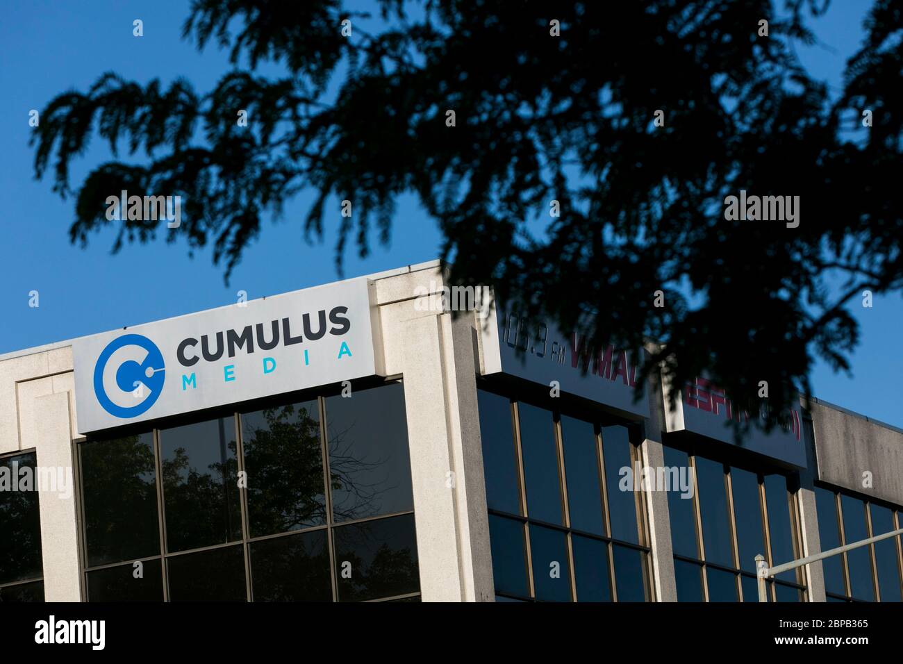 A logo sign outside of a facility occupied by Cumulus Media in Washington, D.C., on May 9, 2020. Stock Photo