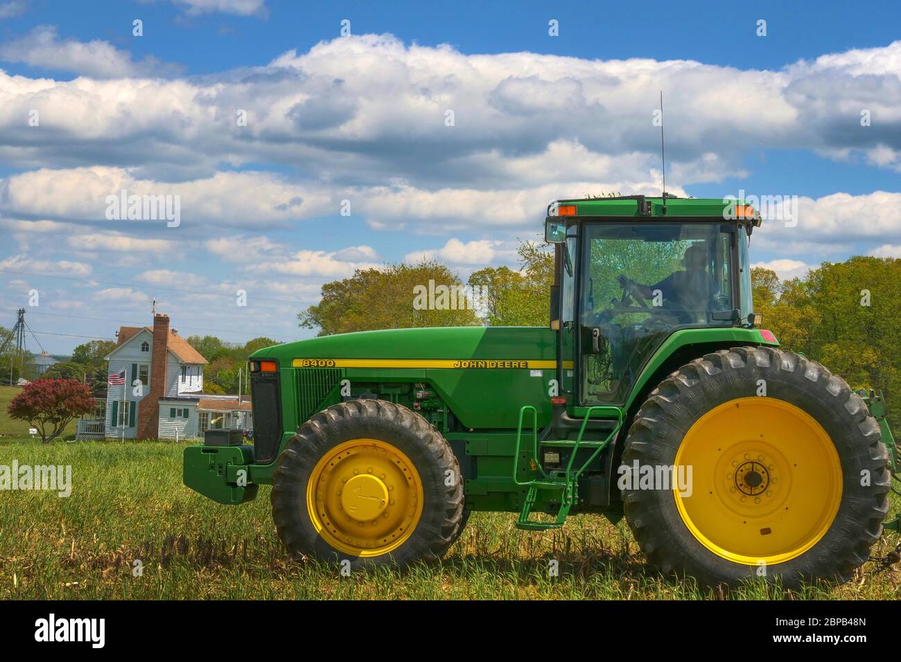 A farmer uses a tractor to prepare a no-till field for soybean planting May 12, 2020 in Montgomery County, Maryland. Stock Photo