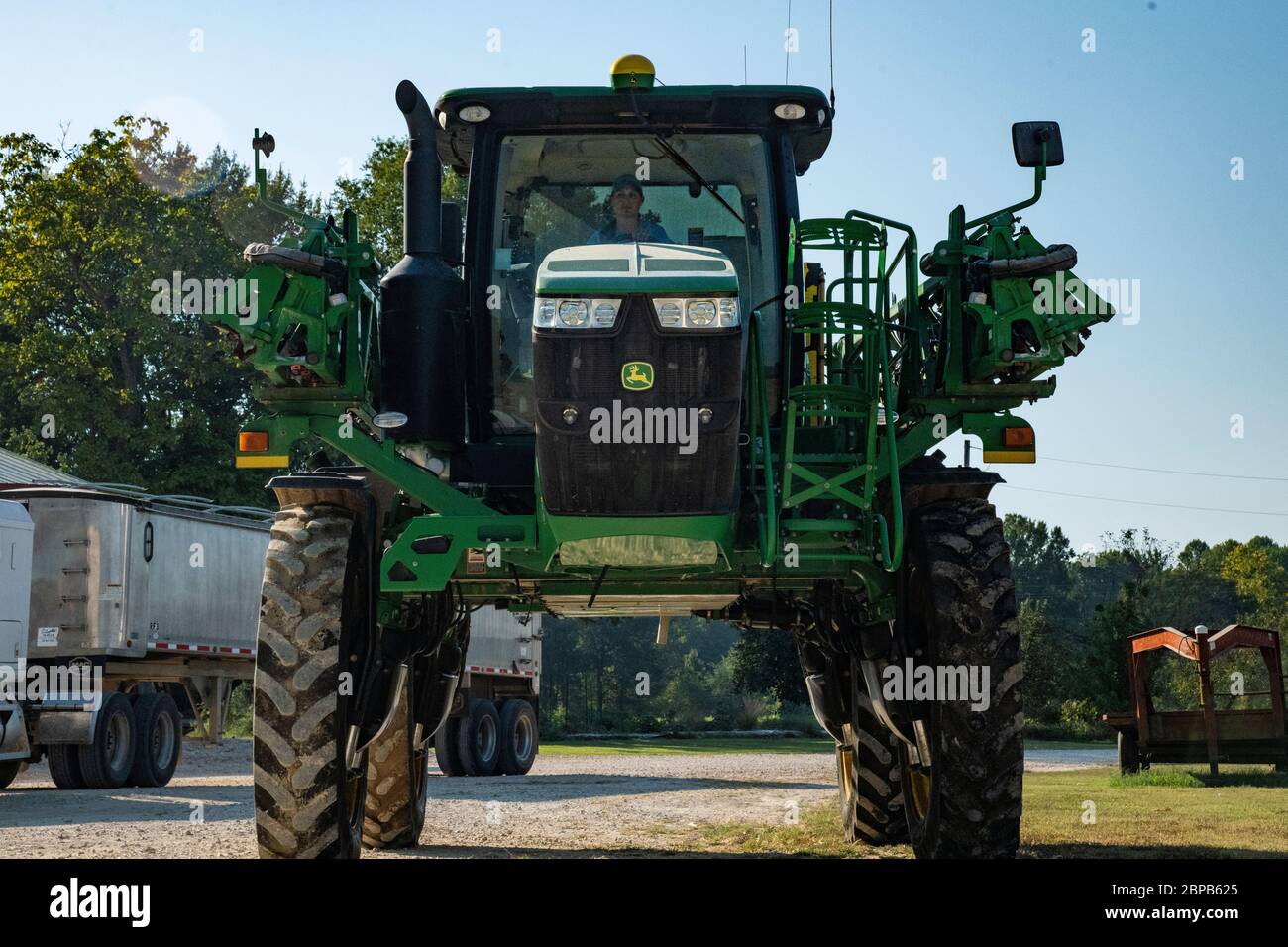 Kim Renfroe-Johnson ween operating a tractor during corn harvest at her family farm September 18, 2019 in Carroll County, Tennessee. The farm utilizes conservation practices developed with the USDA to balance land stewardship and production. Stock Photo