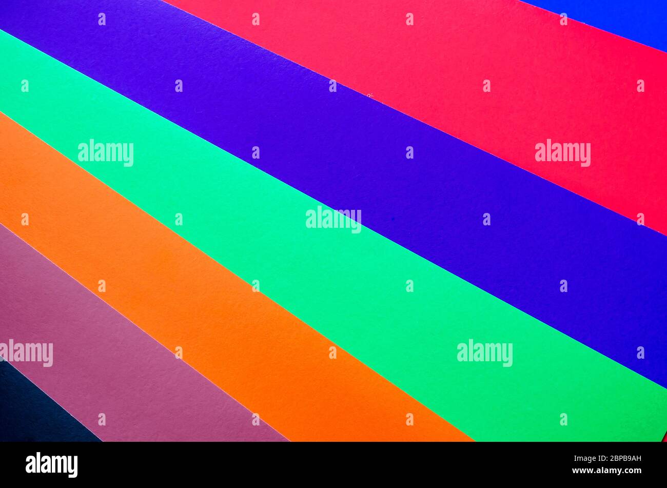 Multicolored paper background. Paper sheets of rainbow colors close-up ...
