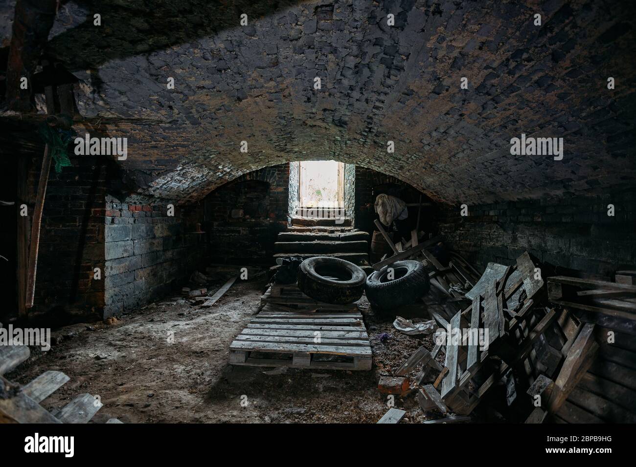 Abandoned empty old dark underground vaulted cellar Stock Photo