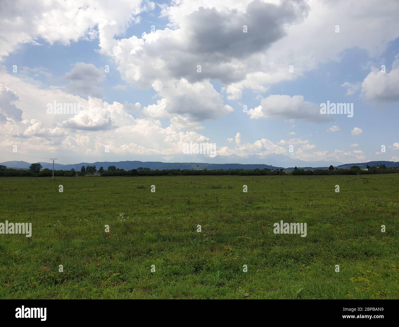 Landscape with blue sky and clouds Stock Photo - Alamy