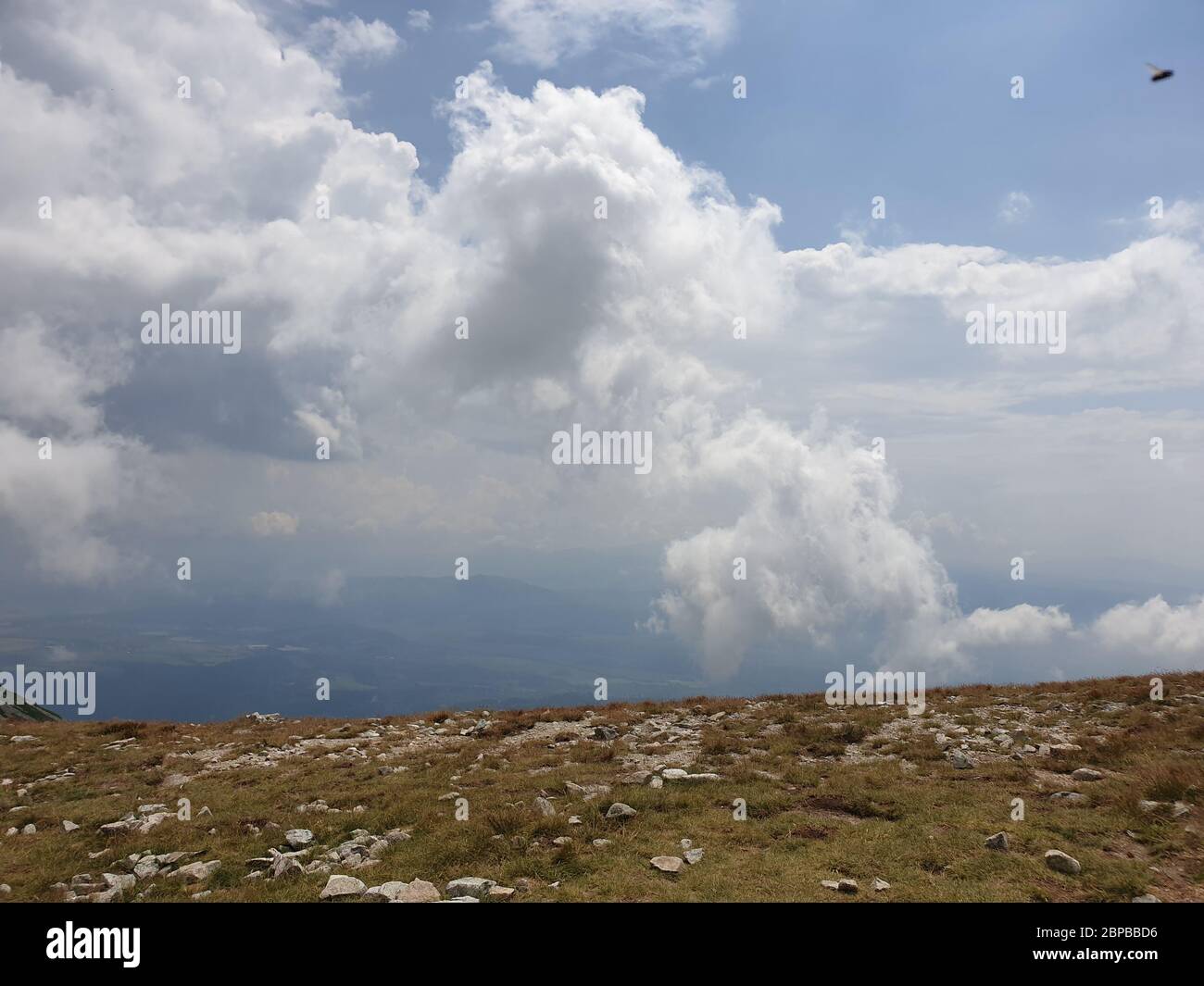 Dark clouds over the mountains Stock Photo