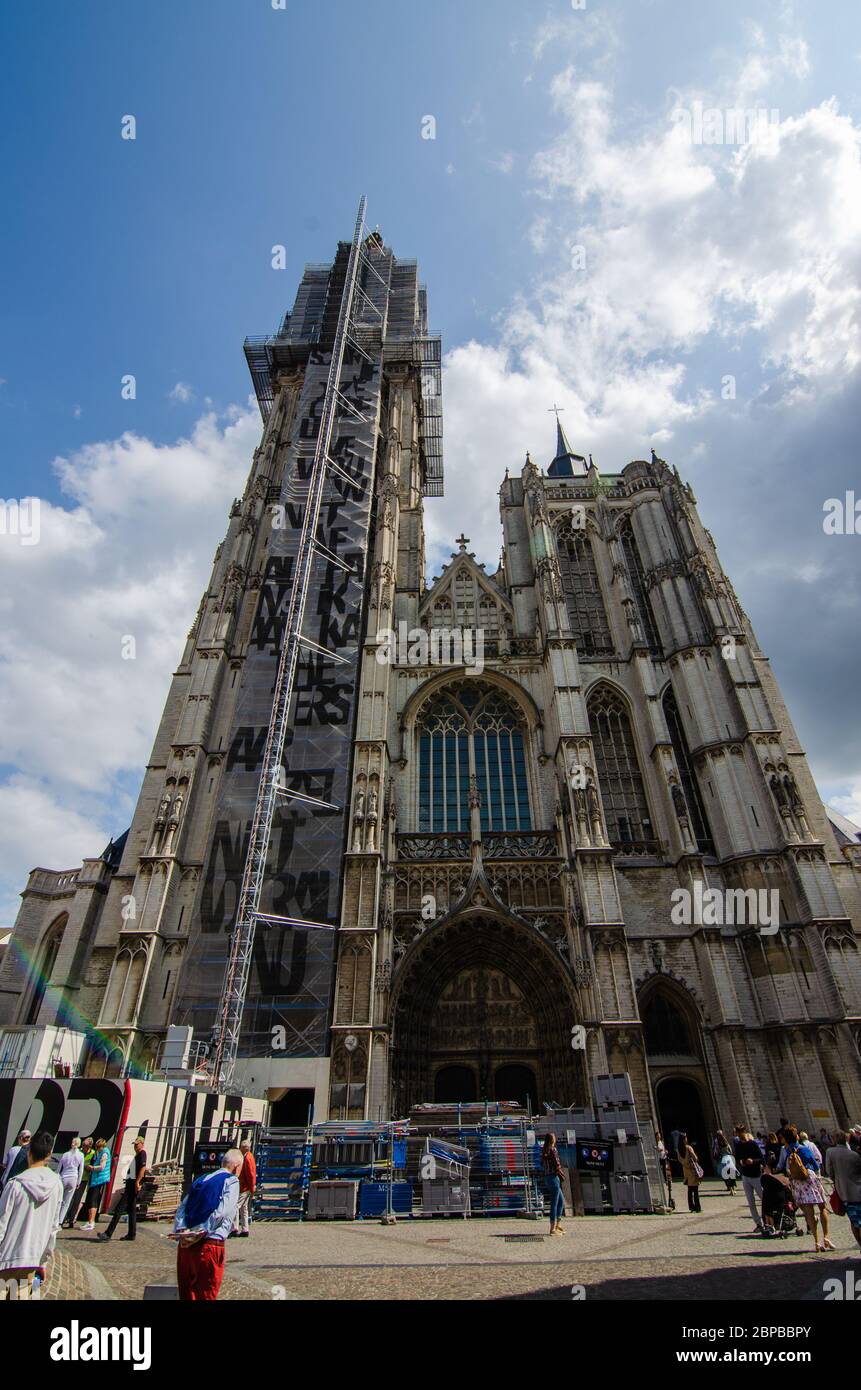Antwerp, Flanders, Belgium. August 2019. View of the imposing entrance facade of the cathedral. You can see the scaffolding for maintenance on the bel Stock Photo