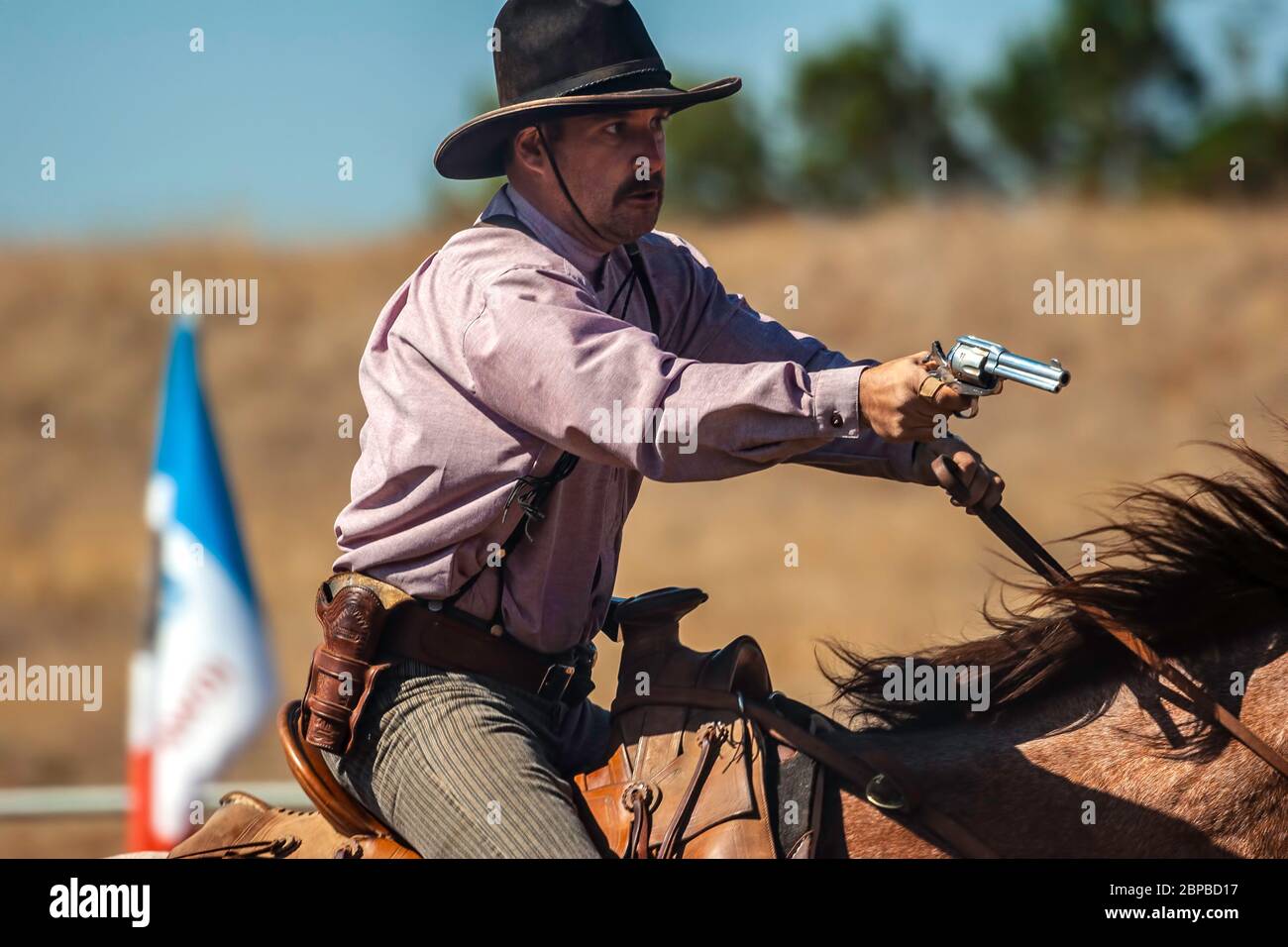 Cowboy on horse, mounted shooting competition, End of Trail Wild West