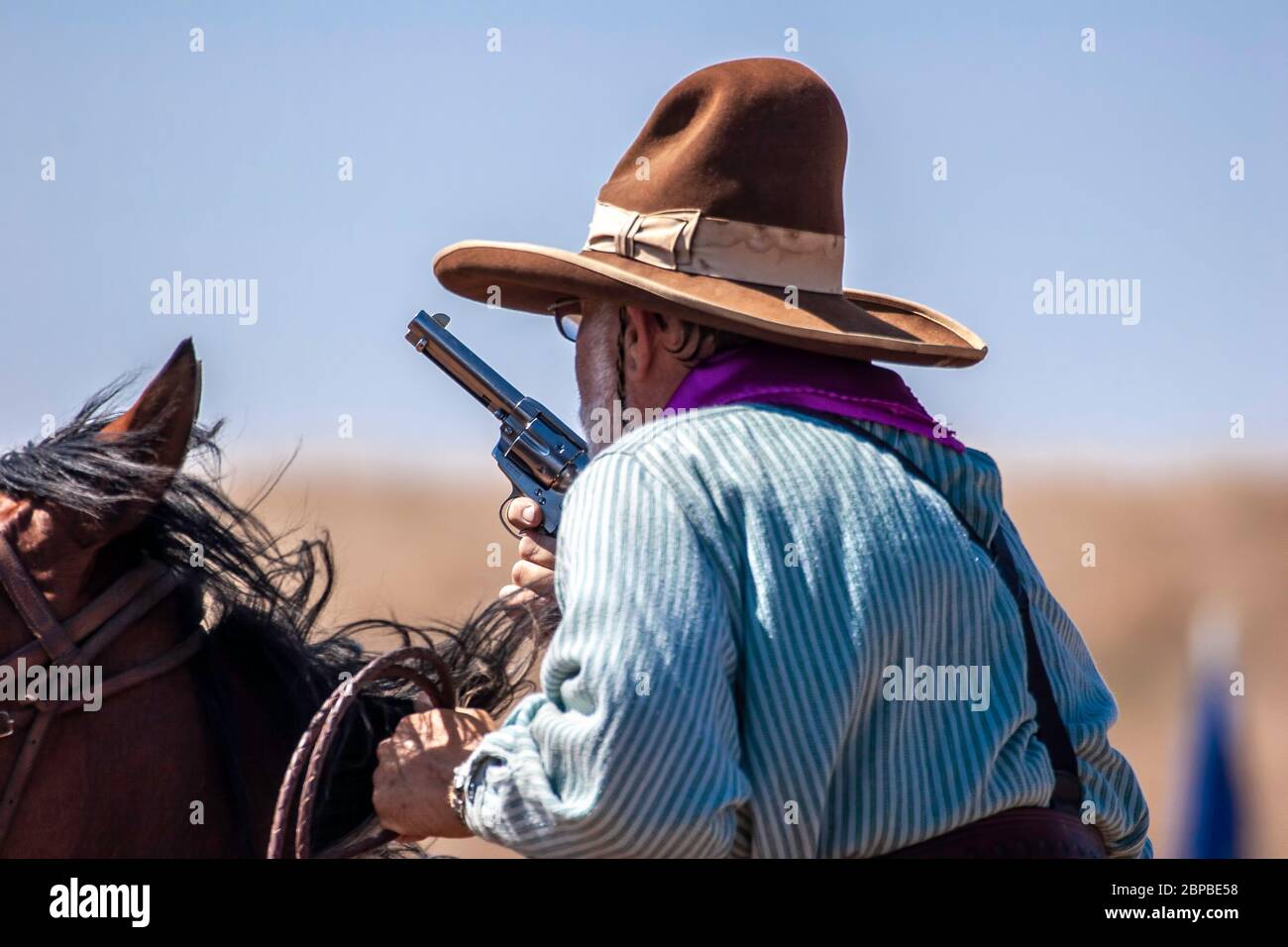 Cowboy on horse, mounted shooting competition, End of Trail Wild West