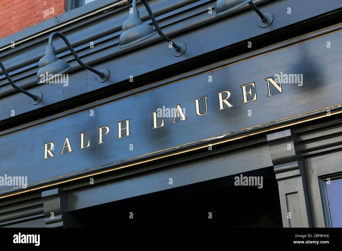 A logo sign outside of a boarded up and closed Ralph Lauren retail store  location in Washington, D.C., on May 9, 2020 Stock Photo - Alamy