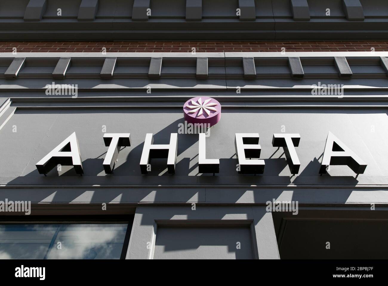A logo sign outside of a Athleta retail store location in Washington, D.C., on May 9, 2020 Stock