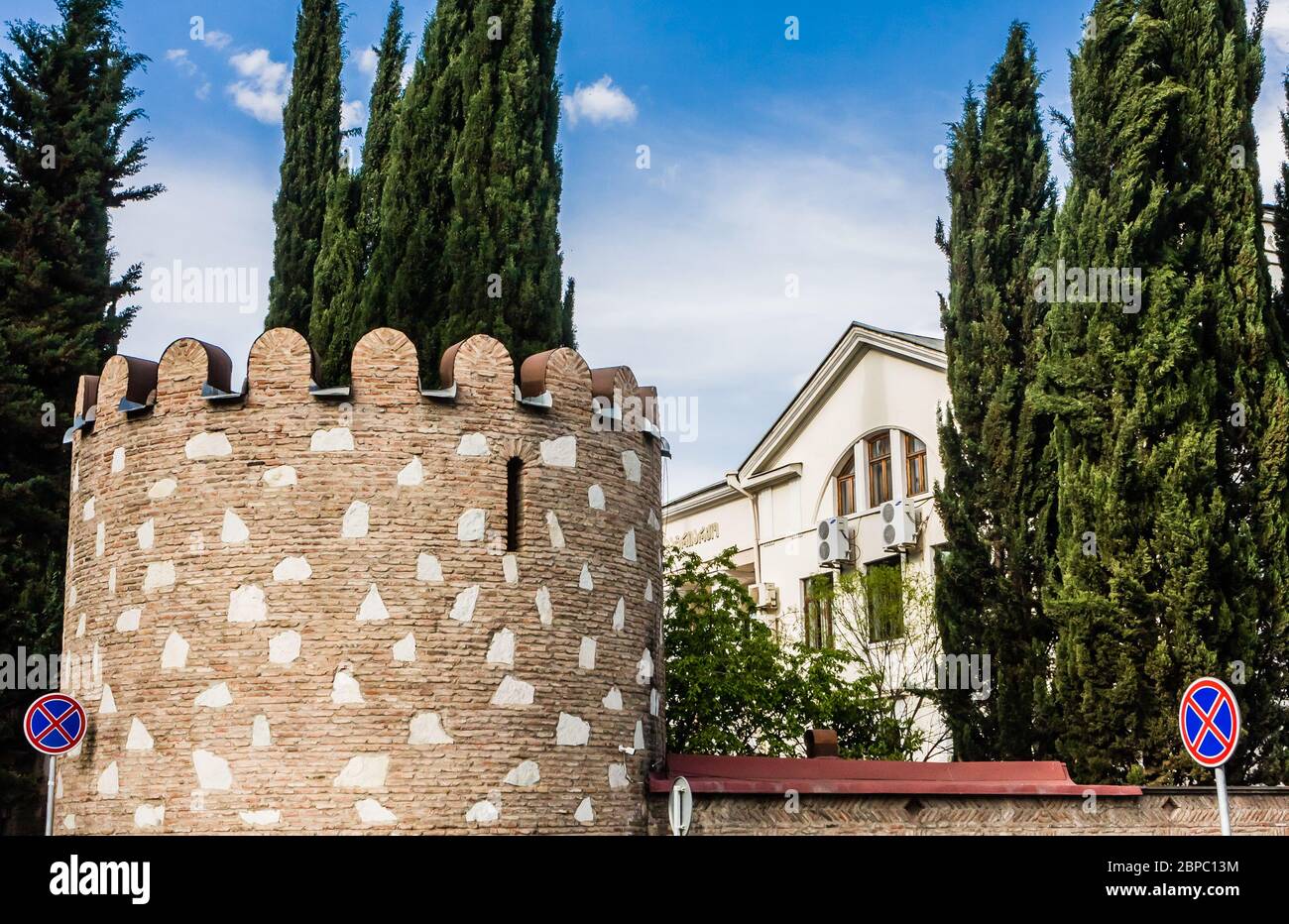 The massive ramparts with towers surround the building of Patriarchate of the Georgian Orthodox Church, located in Erekle II square in Tbilisi, Georgi Stock Photo