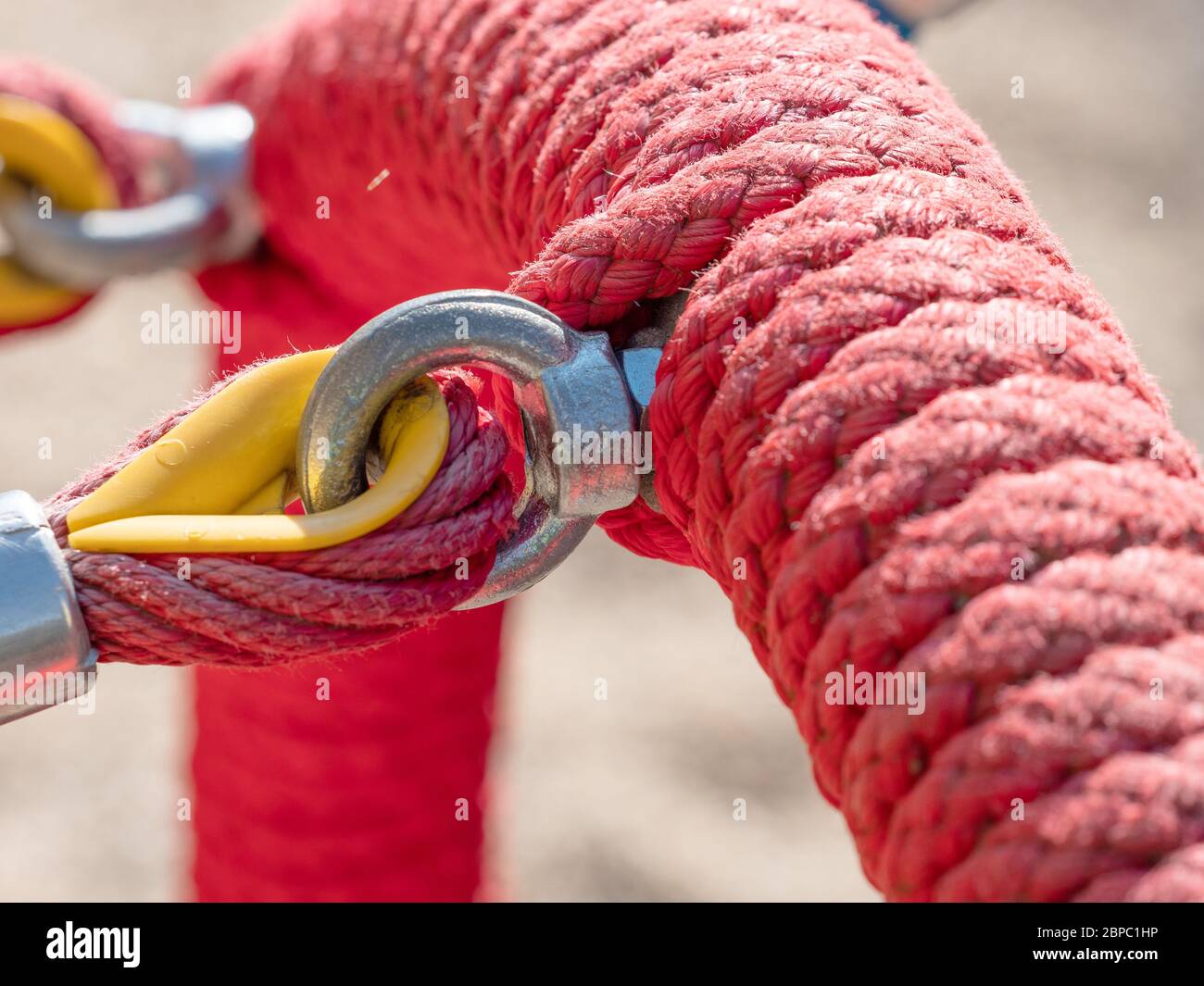 Red Rope in A Knot. Red rope focus playground kids play fun happy ...