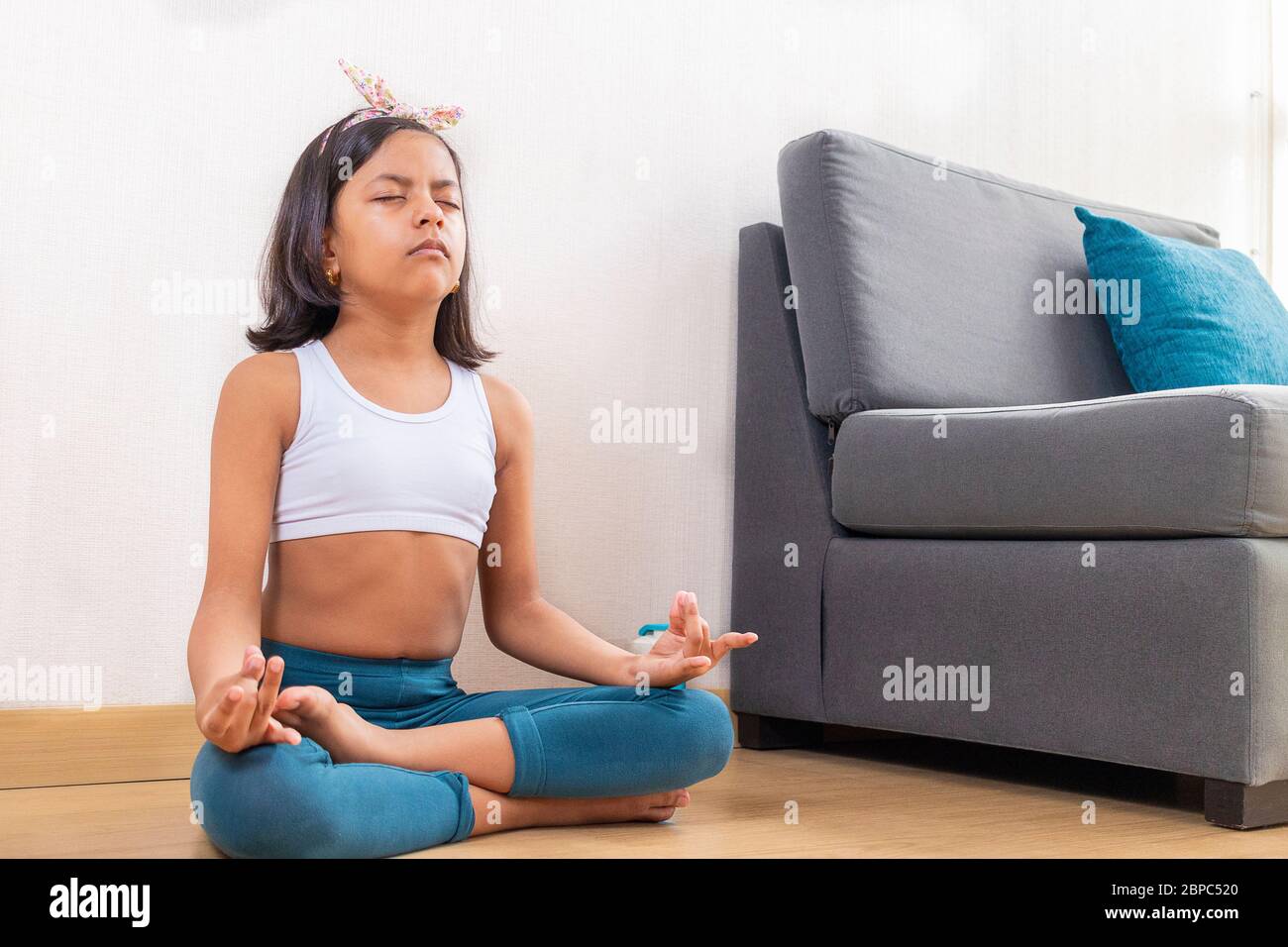 Teen girl doing yoga at home Stock Photo - Alamy