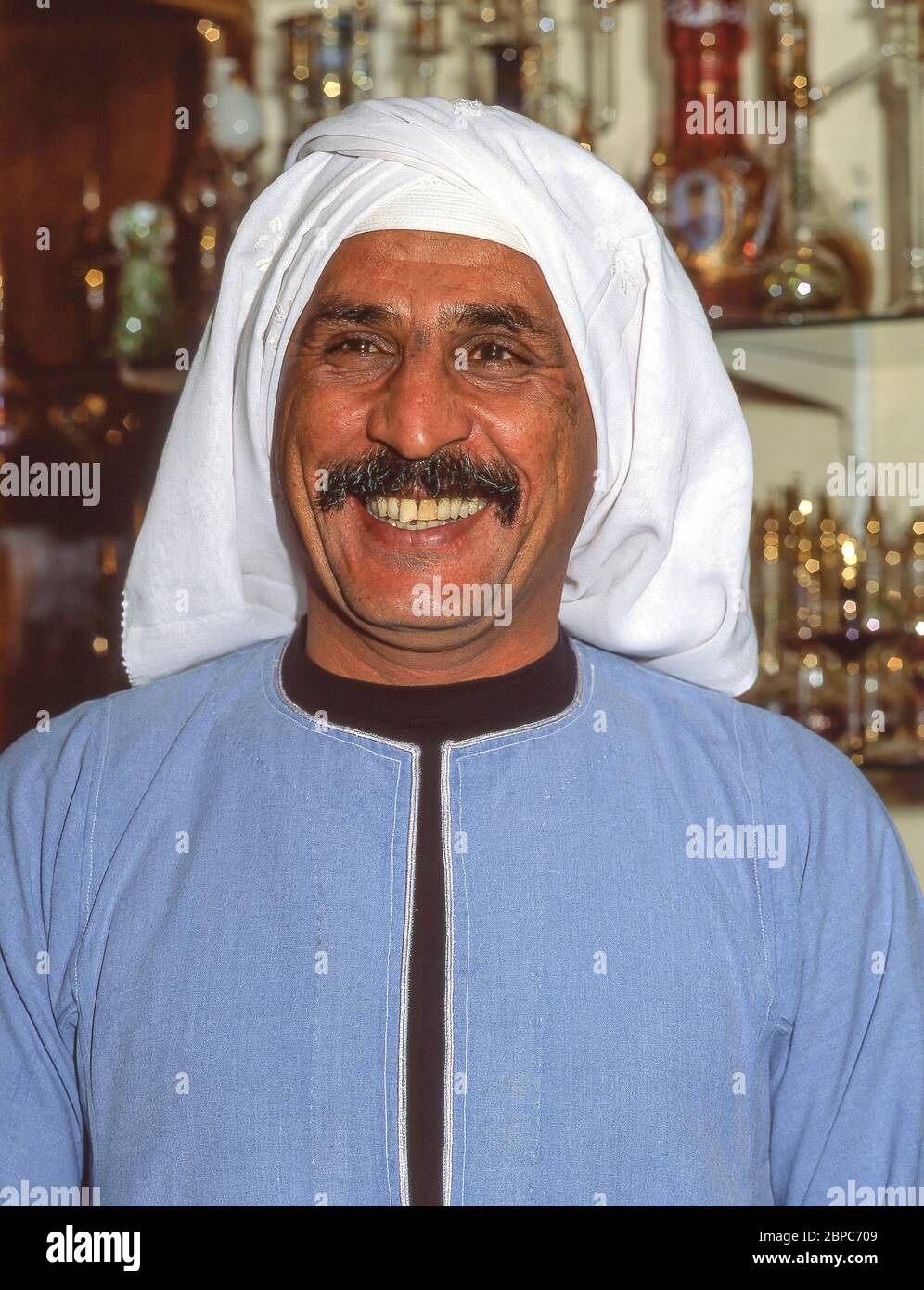 Souvenir shop owner in store, Luxor, Luxor Governorate, Republic of Egypt Stock Photo