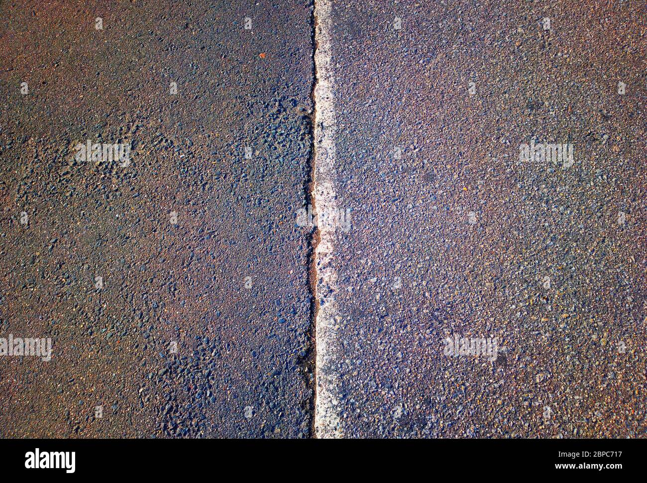 Dividing pit line on asphalt road background Stock Photo