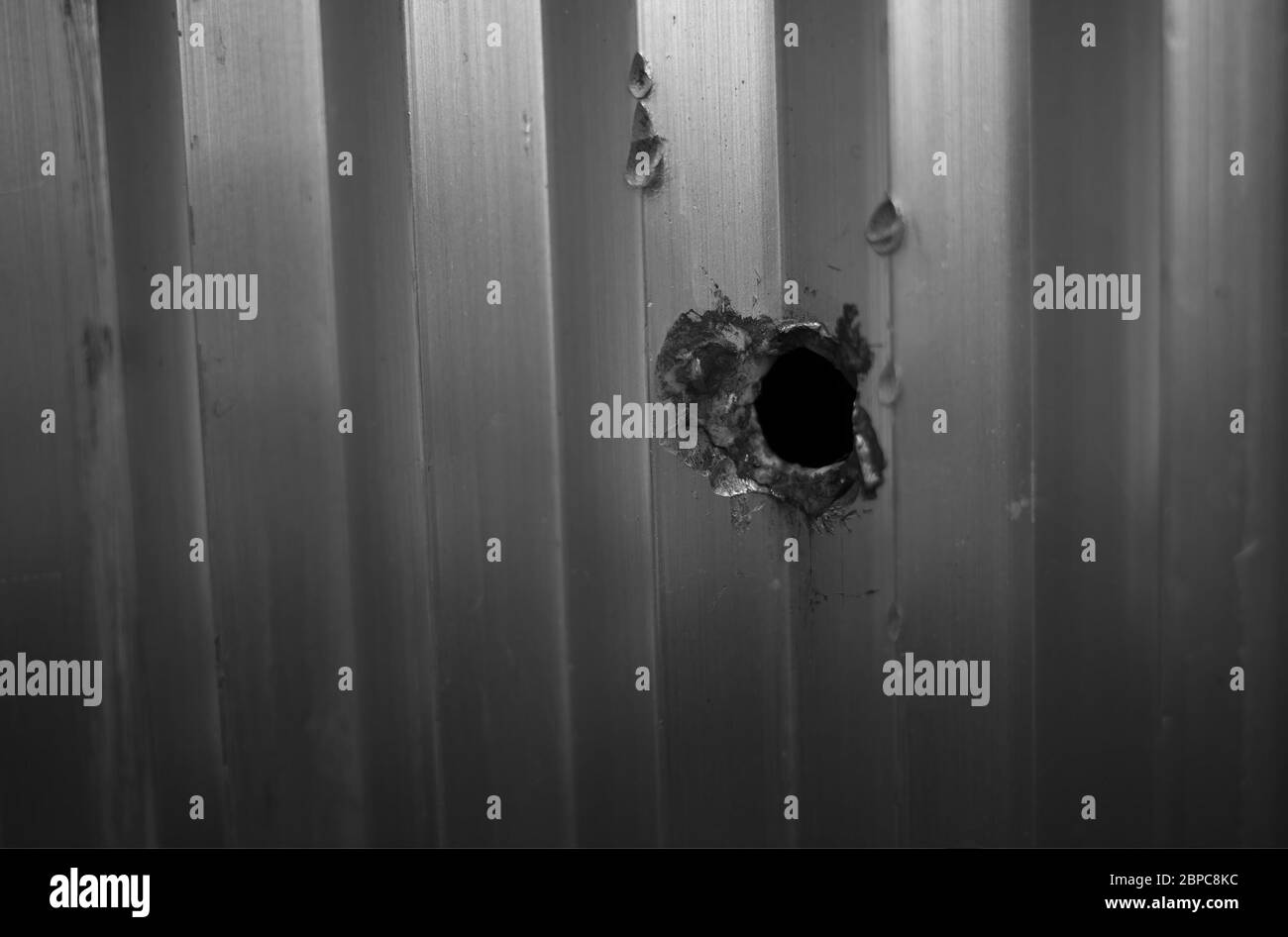 Bullet hole in metal texture background Stock Photo - Alamy