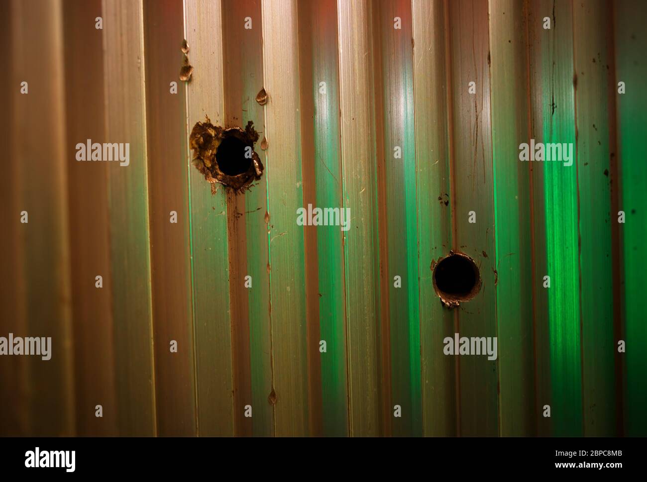 Bullet holes in metal texture background Stock Photo - Alamy