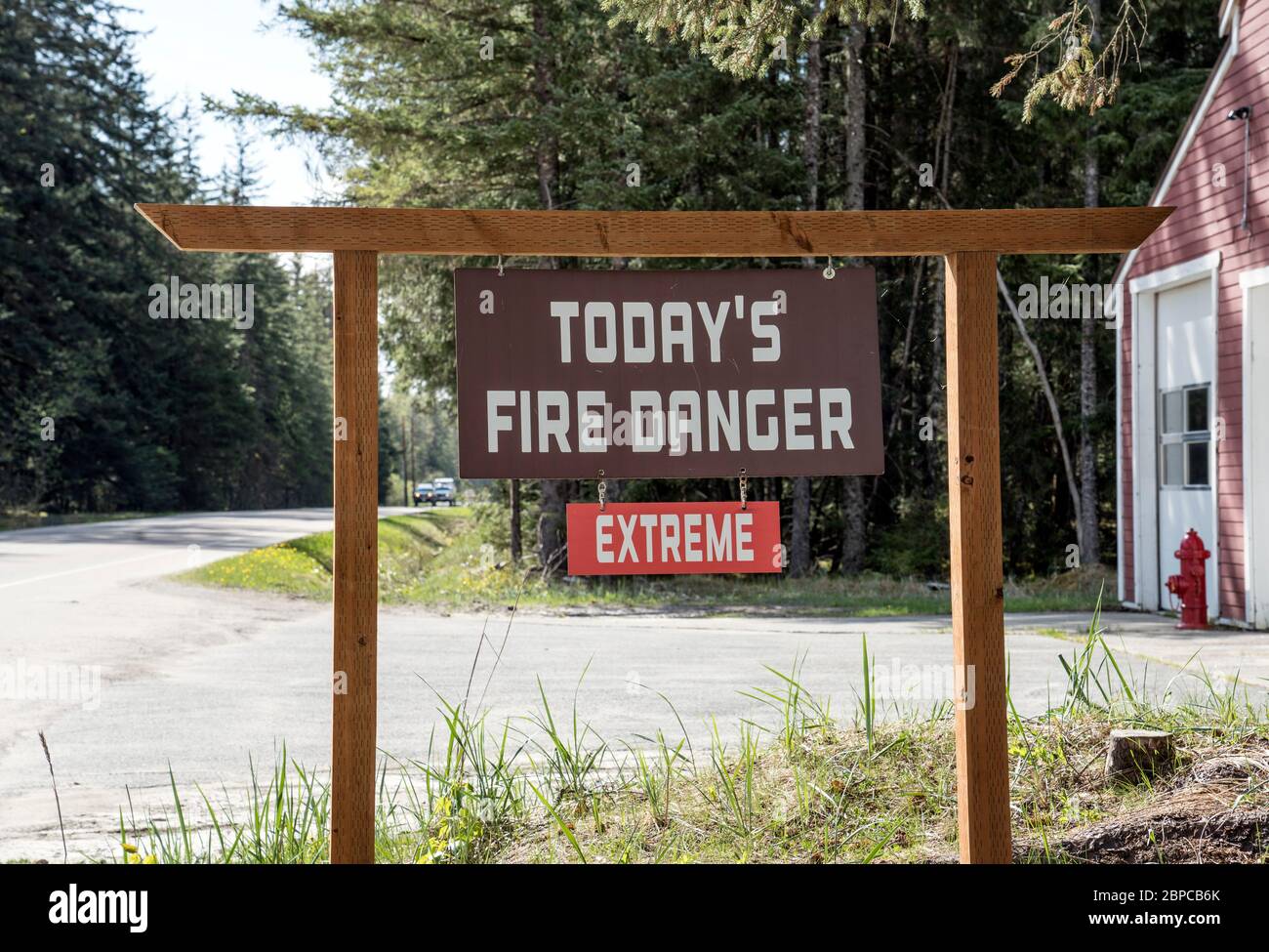 Sign outside a fire station with Today's Fire Danger Extreme in summer. Stock Photo