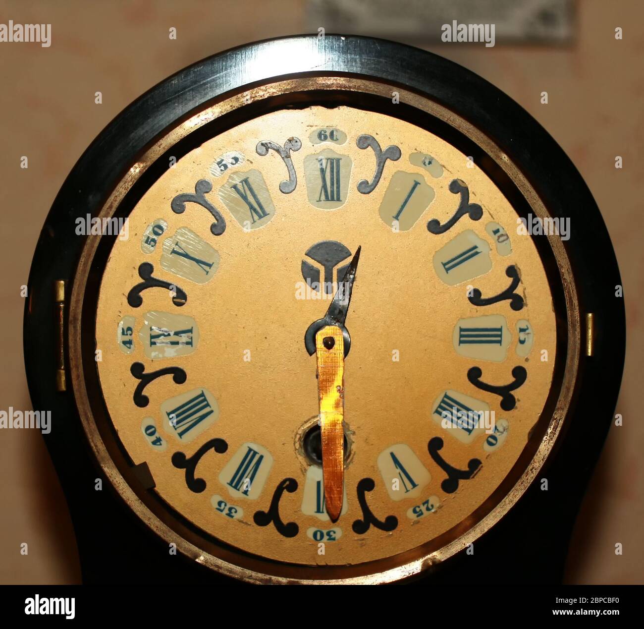 Old vintage clock with roman numerals on the dial Stock Photo Alamy